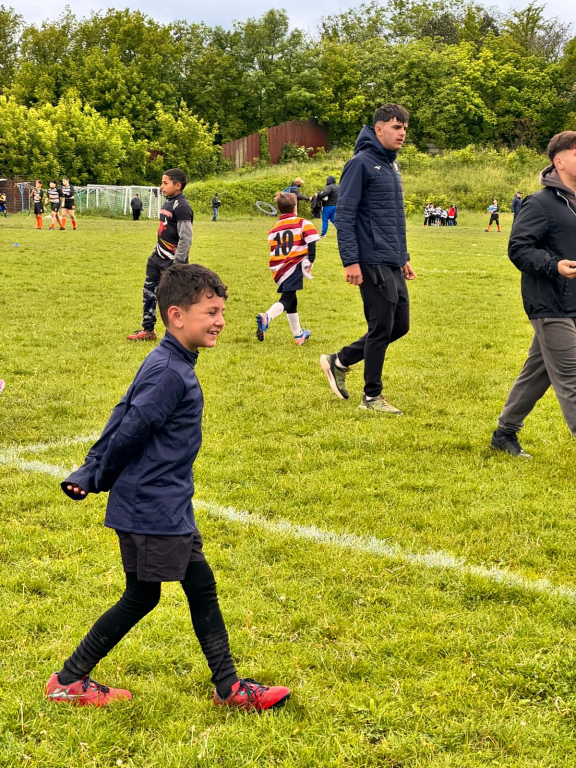 GALERIE FOTO -- O zi cu suflet sub stropii de ploaie. Copiii rugby-ului, între joc și vis