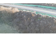 FOTO/VIDEO - Autostrada care trece prin mijlocul unei gropi de gunoi