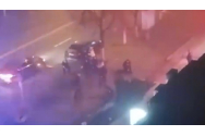 VIDEO: Imagini virale cu un polițist îmbrâncit de trei bărbați în plină stradă. În ajutorul agentului au venit mascații